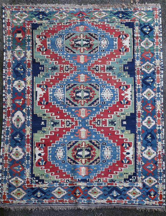 A Caucasian Kazak red and blue ground rug, 7ft 4in by 6ft 2in.